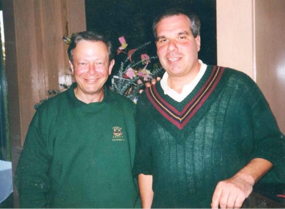 Monsignor Bob Cilinski (right) with a participant (left) at the Gabriel Homes Golf Tournament.