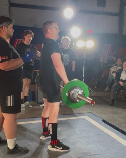 Gabriel Homes resident powerlifting at the Winter Wrecker Tournament.