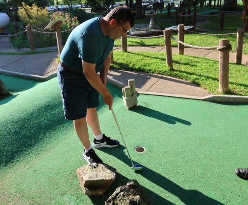 Gabriel Homes resident playing mini golf.