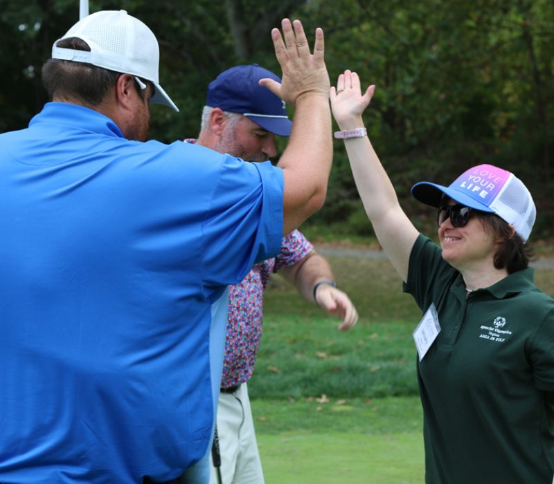 High-fiving at the 30th Annual Gabriel Homes Golf Tournament.