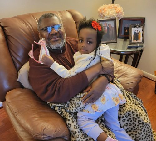 Reuben (left) with his granddaughter (right).