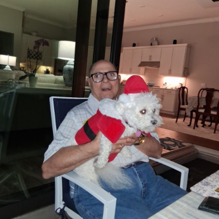 Gabriel Homes resident holding a dog in Florida.