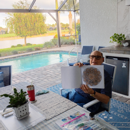 Gabriel Homes resident holding artwork up in Florida.