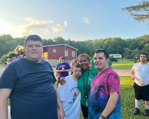 Gabriel Homes resident (second to the left) at a summer camp.